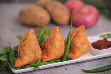 Samosa Indian famous street food snack closeup with selective focus and blur
