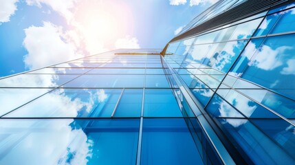 Fototapeta premium The glass Windows of modern office buildings reflect the blue sky and clouds, symbolizing the transparency of business practices.
