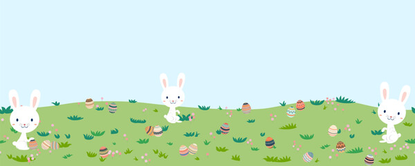 Easter landscape bunnies with colorful eggs and daisy flower on meadow under blue sky