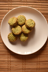 A closeup picture of a freshly prepared bakery biscuits on a white plate.