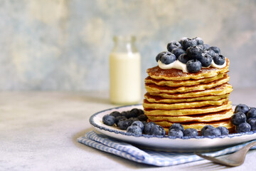 Stack of fresh hot pancakes with maple syrup and blueberries. - 760779279