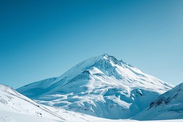 Fototapeta na wymiar A snow-covered mountain peak under a clear blue sky Perfect for ski resort promotions Outdoor gear advertisements Or inspirational travel blogs.