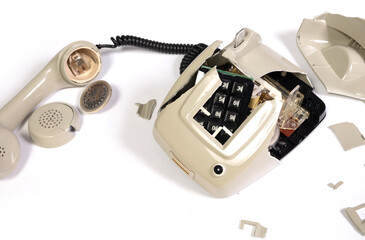 Part of a broken old telephone, phone with dial plate - plastic phone