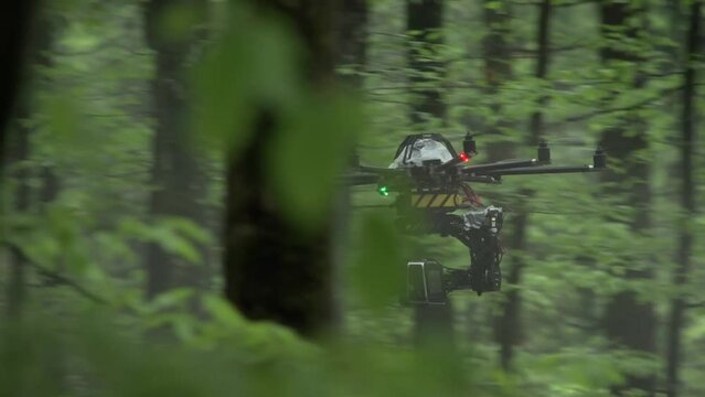 professional camera drone at movie set in forest