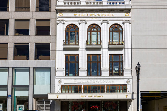 The  Williams Sonoma building with tall black light posts, brown wood trim around the windows and gold letters at Union Square in San Francisco California USA