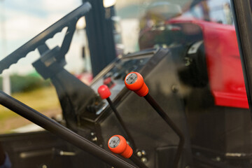 Close-Up of Tractor Control Levers in Daylight