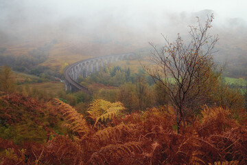 Scottish viaduct bridge in the autumn. Travel and tourist destination in Europe. Glenfinnan Viaduct, Highlands, Scotland, United Kingdom