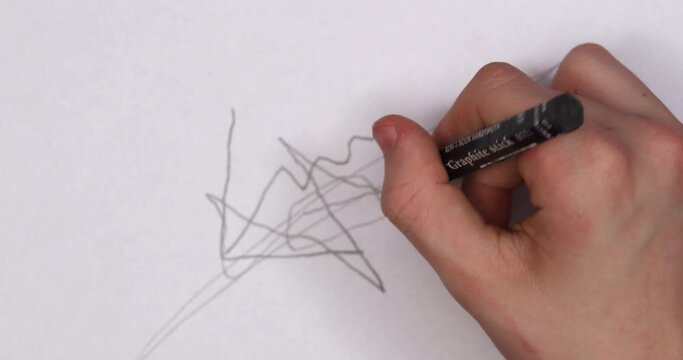 Doodle hand drawing on a paper. Top view, 4K stop motion animation.