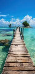 vertical photograph of an old wooden jetty crossing a paradisiacal beach to an island with a resting area. tropical and paradisiacal vacations