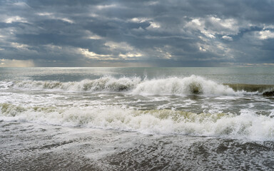 Gray and stormy sea in spring time background