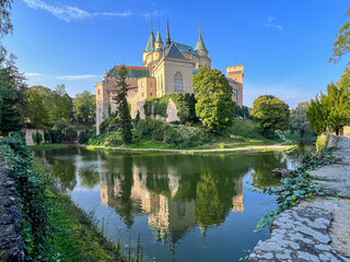 Fairy-tale Bojnice Castle in Slovakia, central Europe, owned by family of Palfi. Lake reflection. 