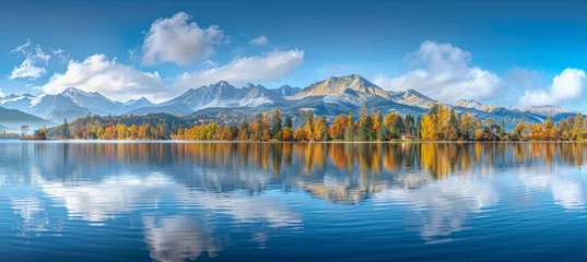 Photo sur Plexiglas Tatras Autumn high tatra lake  stunning mountain view with sunlit pine forest for serene hiking