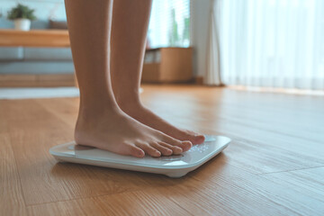 Woman Feet Standing Weighing Scales, Female Checking BMI Weight Loss. Barefoot Measuring Body Fat...