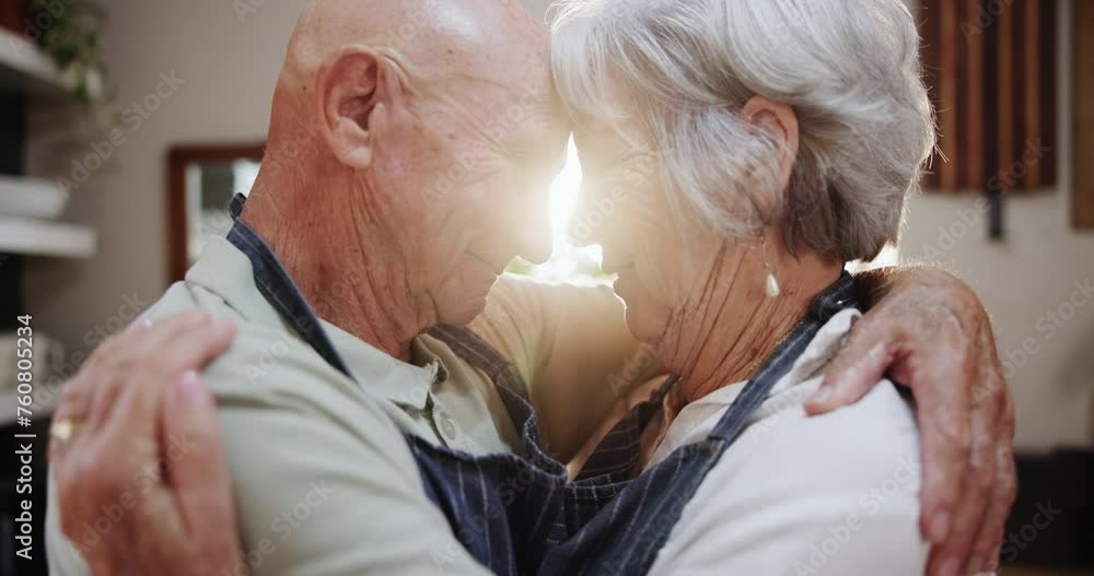 Wall mural Senior, couple and hug in kitchen with love, support and care in marriage and retirement. Elderly, man and woman embrace with kindness or gratitude for cooking in home together with happiness