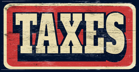 Aged and worn taxes sign on wood