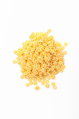 Stars shaped pasta on white background. Uncooked, dry macaroni. Top view