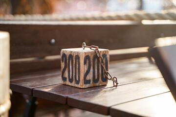 Wooden cube with table number for booking a table in a restaurant outdoor