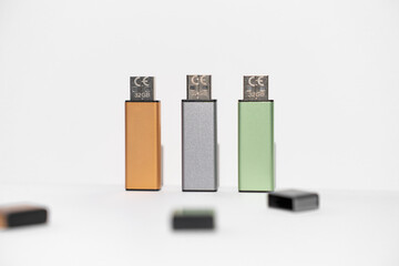 usb drives of different colors on a white background