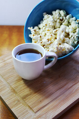 Coffee cup and popcorn. Traditional snack in the afternoon in Brazil.