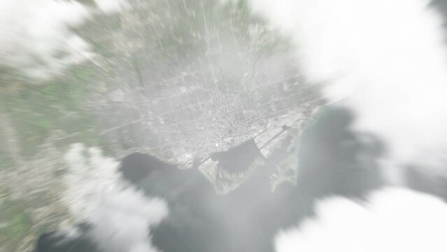 Earth zoom in from space to Toronto, Canada. Followed by zoom out through clouds and atmosphere into space. Satellite view. Travel intro. Images from NASA