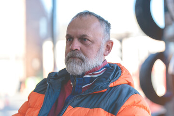 close-up of A man waiting at the garage for his car to be serviced and winter tires fitted ahead of the winter season