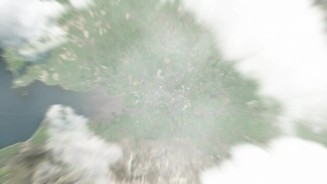 Earth zoom in from space to Tralee, Ireland. Followed by zoom out through clouds and atmosphere into space. Satellite view. Travel intro. Images from NASA
