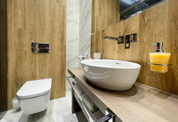 Stylish white table sink in a modern bathroom wooden interior