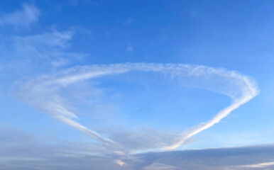 Fototapeta na wymiar Anomalous cloud in the form of a ring in the blue sky