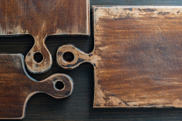 Three old retro cutting boards of various shapes on wooden background, closeup