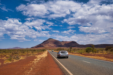Highway with two cars in the remote desert outback of Karajini National Park, Western Australia....