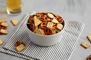 Homemade Cracker Snack Mix with Pretzels in a Bowl, side view.