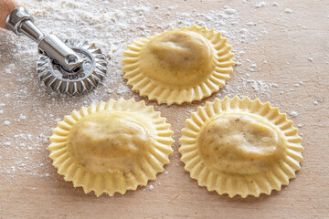 Homemade preparation of round raviole