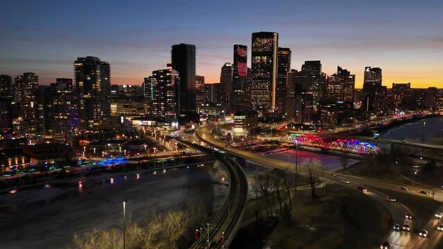 Aerial of Calgary's modern skyline at sunset. 