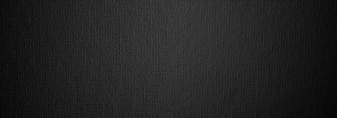 Black canvas paper grain texture horizonta long background.