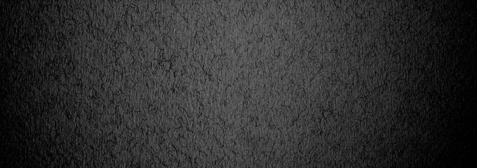 Black paper grain texture horizonta long background.