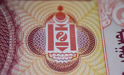Closeup of Mongolia Soyombo national Sanskrit Symbol on old Tugrik currency banknote  (focus on center)