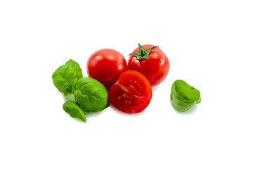 Ripe red tomato and basil on a white background isolate