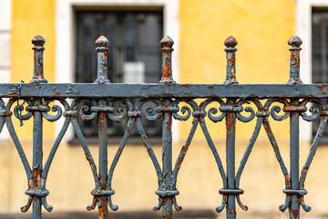Green painted wrought iron fences close up
