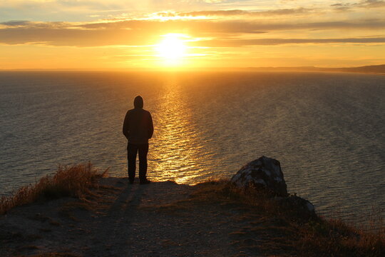 silhouette of a person during sunset