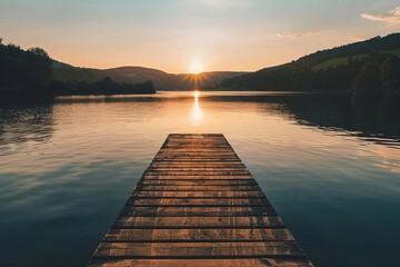 Golden hour over a serene lake with a single wooden pier Evoking feelings of peace and solitude perfect for contemplative or nature-inspired imagery - obrazy, fototapety, plakaty