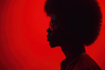 black history month black man with afro face profile on a red background