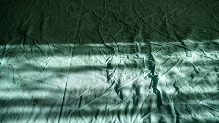 Strong wrinkles on a bed sheet