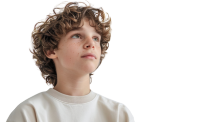 A young boy with curly hair wearing a white shirt gazes into the distance with a thoughtful expression