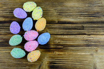 Easter eggs made of styrofoam on a wooden background. Top view