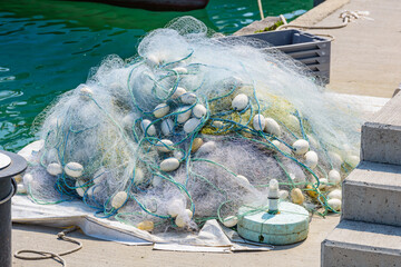 Tangled fishing net on the pier. Fishing industry