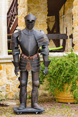 Old knight armor near the ancient building in Nessebar, Bulgaria. Old town