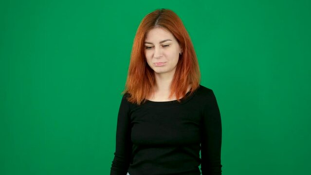 The red-haired girl got upset, lowered her eyes, pouted her lips, raised her head, rolled her eyes.