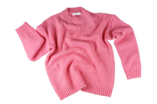 Pink flying crumpled women's autumn knitted sweater isolated on white, transparent background. Creative clothing concept, trendy fall winter cozy creasy jersey pullover. Fashion, sale, autumn discount