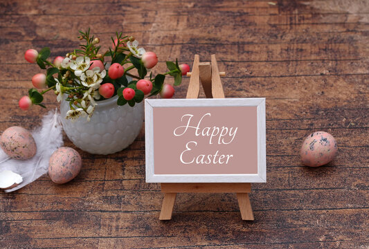 Greeting card Happy Easter: Easter eggs with flowers and the text Happy Easter.