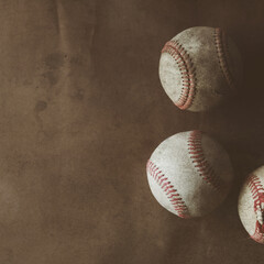 Grunge baseball square background with old vintage used balls from sport on brown texture backdrop.